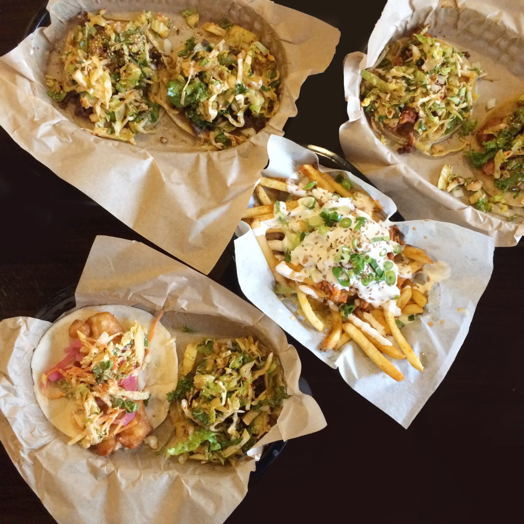 Tacos from Del Seoul (pictured here with kimchi fries) // Photo: @chelsias