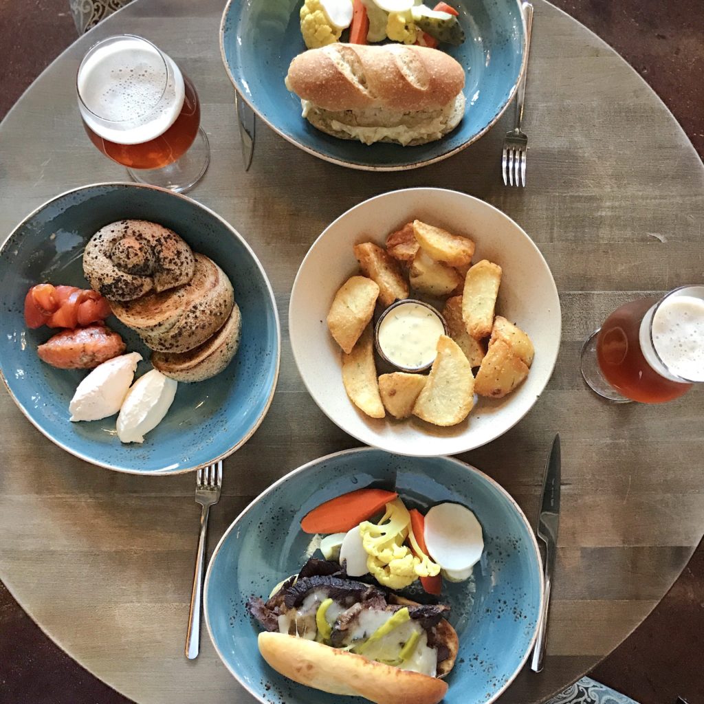 Fab Review: Brunch at Band of Bohemia // Fried Chicken Breast, Fried Kennebecs, Brisket Cheese Steak, and Knot Bagel // Photo: @topchicagoeats