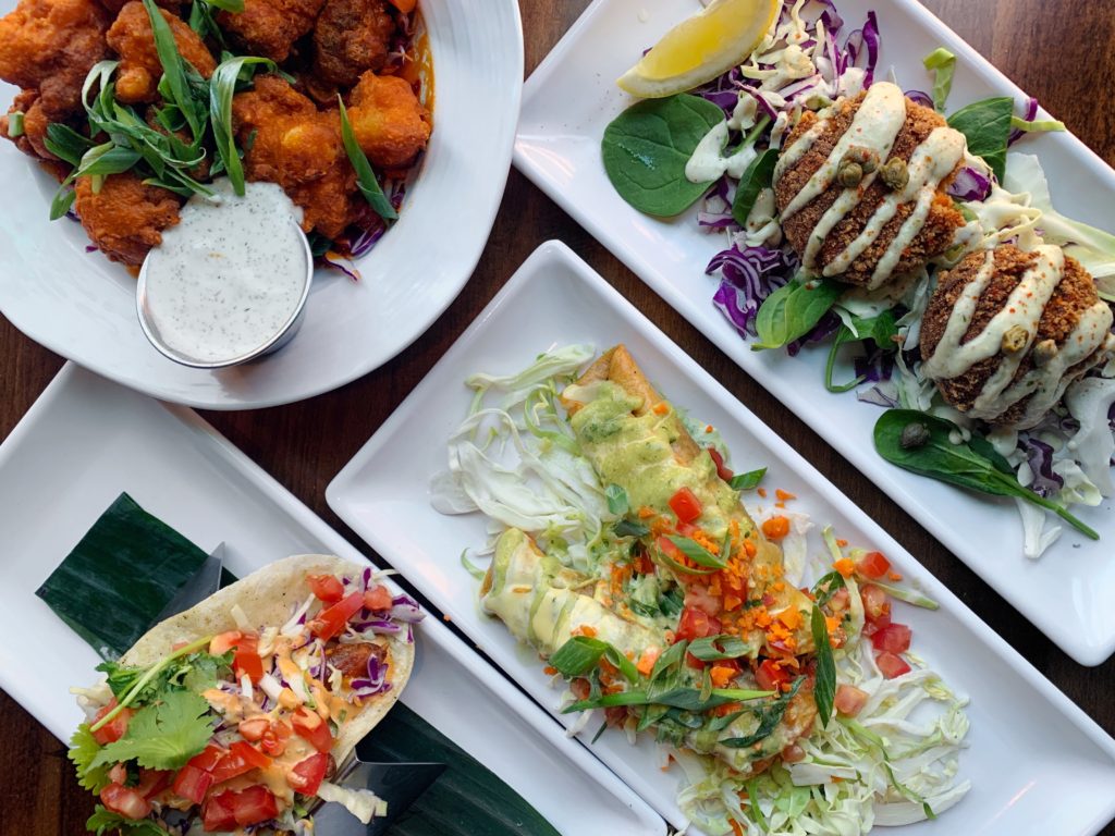 Fab Review: No Bones Beach Club #fabfoodchicago // Crab Cakes, Jackfruit Flautas, Beer Battered Avocado Taco, and Buffalo Cauliflower // Photo: @topchicagoeats